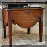 F23. Wooden stand with brass escutcheon. 